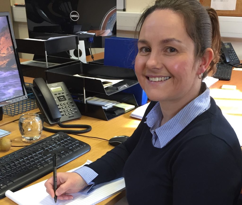 A member of the Stockdale team at her desk