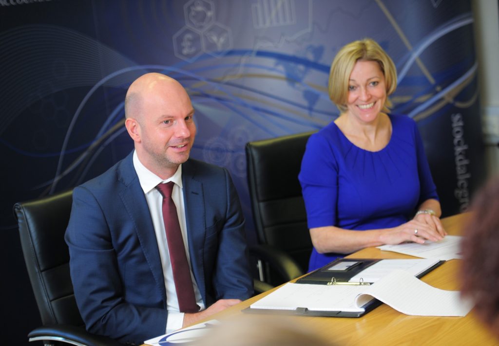 Keith Stockdale and a colleague in a client meeting