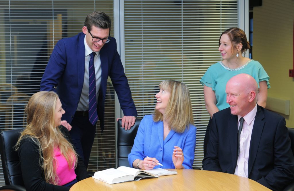 The Stockdale team around a meeting table